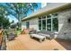 Spacious back deck with wood flooring, stylish furniture, and outdoor lounging at 8905 Stonebriar Dr, Indianapolis, IN 46259