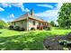 Landscaped backyard showcasing a well-manicured lawn, established trees, and an inviting outdoor space at 8905 Stonebriar Dr, Indianapolis, IN 46259