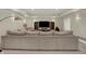 Cozy basement featuring an entertainment area, large sectional sofa, and recessed lighting at 8905 Stonebriar Dr, Indianapolis, IN 46259