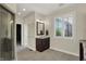 Bathroom with a glass-enclosed shower, a dark wood vanity, and modern tile flooring at 8905 Stonebriar Dr, Indianapolis, IN 46259