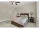 Inviting bedroom with a ceiling fan, a soft throw blanket, and carpeted floors for ultimate comfort at 8905 Stonebriar Dr, Indianapolis, IN 46259