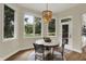 Bright breakfast nook with large windows and a beaded chandelier at 8905 Stonebriar Dr, Indianapolis, IN 46259