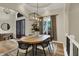 Beautiful dining room with a modern chandelier, hardwood floors, and stylish furnishings at 8905 Stonebriar Dr, Indianapolis, IN 46259