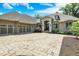 Elegant home featuring a circular paved driveway, a stone entryway, and an attached three-car garage at 8905 Stonebriar Dr, Indianapolis, IN 46259