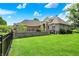 Charming single-Gathering home boasting a beautifully landscaped front yard, brick facade, and attached garage at 8905 Stonebriar Dr, Indianapolis, IN 46259