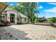 Luxurious home with an expansive circular paved driveway, professional landscaping, and a stone entryway at 8905 Stonebriar Dr, Indianapolis, IN 46259