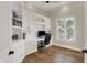 Bright home office with custom built-in cabinets, hardwood floors, and natural light at 8905 Stonebriar Dr, Indianapolis, IN 46259