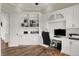 Well-appointed home office with custom built-in cabinets, hardwood floors, and ample storage space at 8905 Stonebriar Dr, Indianapolis, IN 46259