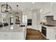 Modern kitchen featuring a center island with stone countertops and stainless steel appliances at 8905 Stonebriar Dr, Indianapolis, IN 46259