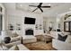 Bright living room showcasing a fireplace, built-in shelving, and comfortable seating area at 8905 Stonebriar Dr, Indianapolis, IN 46259