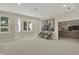 Bright and airy living room featuring natural light, comfortable seating, and artwork at 8905 Stonebriar Dr, Indianapolis, IN 46259