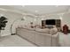 Spacious living room featuring plush seating and entertainment area with ample lighting at 8905 Stonebriar Dr, Indianapolis, IN 46259