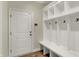 Mudroom featuring a built-in bench, cubbies, and storage hooks at 8905 Stonebriar Dr, Indianapolis, IN 46259