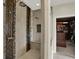 Modern bathroom featuring a glass-enclosed shower with dual shower heads and a walk-in closet at 8905 Stonebriar Dr, Indianapolis, IN 46259