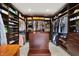 Spacious walk-in closet with custom shelving, drawers, and hanging rods for organized storage at 8905 Stonebriar Dr, Indianapolis, IN 46259