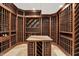 This wine cellar provides ample bottle storage and a convenient tasting table for wine enthusiasts at 8905 Stonebriar Dr, Indianapolis, IN 46259
