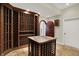 Detailed wine cellar with custom bottle storage and tasting area; features convenient access door at 8905 Stonebriar Dr, Indianapolis, IN 46259