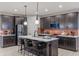 Well-appointed kitchen with a central island, modern appliances, and stylish pendant lighting at 9234 Anthem Ave, Plainfield, IN 46168