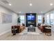 Bright living room showcasing a sleek fireplace, comfortable sofas, and contemporary decor at 9234 Anthem Ave, Plainfield, IN 46168