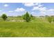 Spacious backyard with a garden area surrounded by lush greenery, offering tranquility and privacy at 928 Cherry Tree Ln, Greenwood, IN 46143