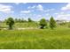 Large grassy backyard, great for Gathering fun, featuring a garden, trees, and open space at 928 Cherry Tree Ln, Greenwood, IN 46143