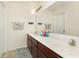 Bathroom with double sink vanity, large mirror, and bright lighting at 928 Cherry Tree Ln, Greenwood, IN 46143