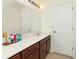 Bathroom featuring a vanity and plenty of counter space with a large mirror at 928 Cherry Tree Ln, Greenwood, IN 46143