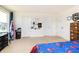 A bright carpeted bedroom features two doors and natural light at 928 Cherry Tree Ln, Greenwood, IN 46143