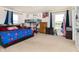 Bright bedroom featuring a bunk bed, large windows, and neutral carpeting at 928 Cherry Tree Ln, Greenwood, IN 46143