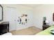 Bedroom corner featuring a wooden dresser, kid-friendly artwork and three doors at 928 Cherry Tree Ln, Greenwood, IN 46143