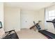 Bedroom featuring neutral paint, carpet, one window and a variety of workout equipment at 928 Cherry Tree Ln, Greenwood, IN 46143
