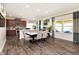 Open-concept dining and kitchen area with modern finishes, plenty of counter space, and natural light at 928 Cherry Tree Ln, Greenwood, IN 46143