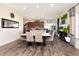 Open-concept dining room with hardwood floors, dining table, and modern decor at 928 Cherry Tree Ln, Greenwood, IN 46143
