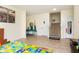 Welcoming entryway featuring bright walls, colorful playmat, and staircase access at 928 Cherry Tree Ln, Greenwood, IN 46143