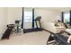 Exercise area with a treadmill and fitness equipment, natural light, and seating at 928 Cherry Tree Ln, Greenwood, IN 46143
