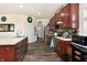 Cherry wood kitchen cabinets and stainless appliances in this home at 928 Cherry Tree Ln, Greenwood, IN 46143