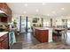 Spacious kitchen with dark wood cabinets, stainless steel appliances, and island at 928 Cherry Tree Ln, Greenwood, IN 46143