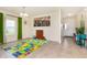 Bright playroom featuring large windows, playmat, and an open layout perfect for entertainment at 928 Cherry Tree Ln, Greenwood, IN 46143