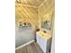 Cozy bathroom features a vanity and shelf for storage at 929 W Roache St, Indianapolis, IN 46208