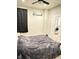 A bedroom with neutral walls, dark drapery, and an ensuite bath at 929 W Roache St, Indianapolis, IN 46208