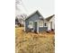 Exterior of charming home with blue siding and inviting entry at 929 W Roache St, Indianapolis, IN 46208