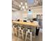 Well-lit kitchen features granite countertops, stainless steel appliances, and ample cabinet space at 929 W Roache St, Indianapolis, IN 46208