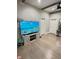 Modern living area featuring a TV, wooden flooring, and ample natural light at 929 W Roache St, Indianapolis, IN 46208