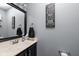 Bathroom featuring a black framed mirror, vanity, and toilet at 9404 Enclave Dr # D, Avon, IN 46123