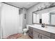 Bathroom with a gray vanity, shower with a curtain, and a toilet at 9404 Enclave Dr # D, Avon, IN 46123
