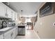 Modern kitchen with stainless steel appliances and views of the dining room at 9404 Enclave Dr # D, Avon, IN 46123