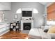 Cozy living room features a fireplace, large windows, and comfortable seating at 9404 Enclave Dr # D, Avon, IN 46123