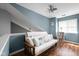 Cozy loft space featuring a futon, hardwood floors, and natural light at 9404 Enclave Dr # D, Avon, IN 46123