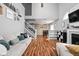 Spacious living room with vaulted ceilings, wood floors, and a staircase to the upper level at 9404 Enclave Dr # D, Avon, IN 46123