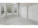 Light-filled bedroom featuring a bay window, double closets, and neutral carpet and walls, offering comfort and style at 9760 Innisbrook Blvd, Carmel, IN 46032